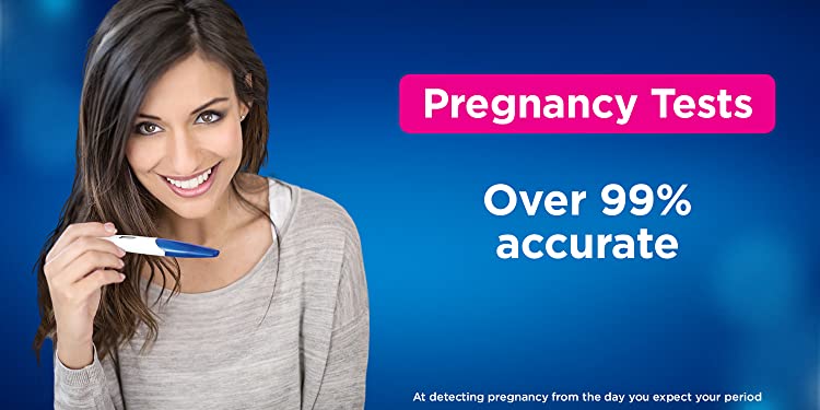 Smiling Woman Holding A Pregnancy Test