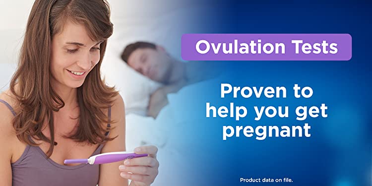 Smiling Woman Holding A Ovulation Test